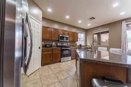 Large kitchen with island, full appliances, and everything needed for home-style meals.