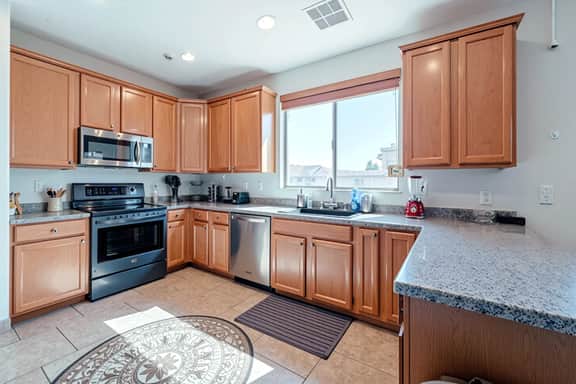 Bright kitchen with stainless appliances and generous counter space